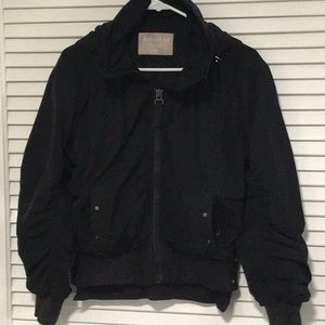 Black bomber jacket with sheered accents on sleeves and back